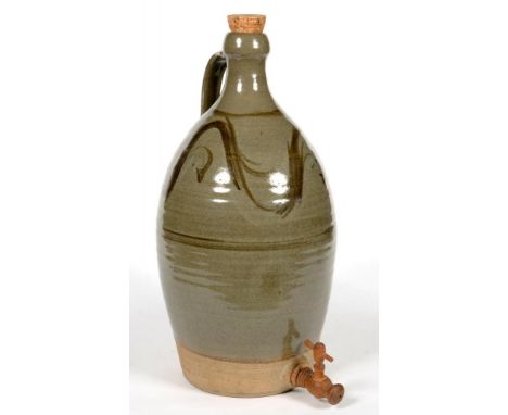 STUDIO POTTERY. A LEACH STYLE GLAZED STONEWARE BOTTLE FITTED WITH A TAP, 56CM H, IMPRESSED SEAL