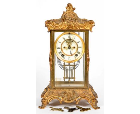 AN ORNATE FRENCH CAST GILTMETAL FOUR GLASS MANTEL CLOCK, WITH BROCOT ESCAPEMENT, ENAMEL DIAL AND MERCURY COMPENSATED PENDULUM