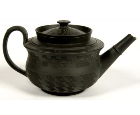AN ENGLISH BLACK BASALT TEAPOT AND COVER, ENGINE TURNED, 9CM H, C1805