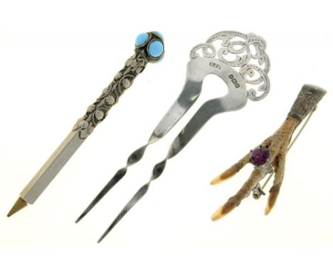 AN EDWARD VII SILVER COMB, 13 CM L, BIRMINGHAM 1904, A SCOTTISH ELIZABETH II SILVER MOUNTED BIRD FOOT BROOCH, 8 CM L, EDINBUR