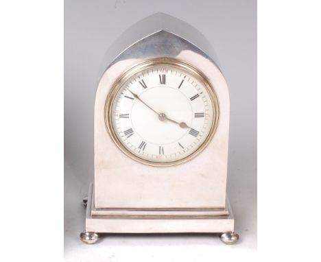 An Edwardian silver cased lancet topped mantel clock, having convex white enamel dial, French eight day brass cylinder moveme