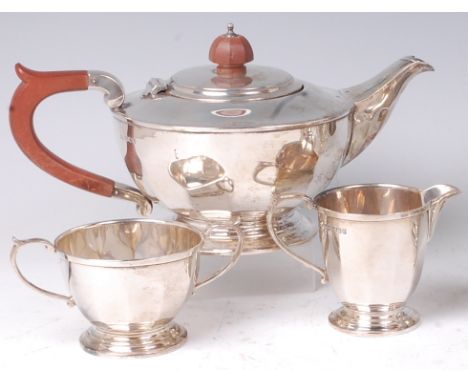 A Mappin & Webb silver three piece teaset, comprising; teapot, twin handled sugar and cream, each of squat and lobed circular