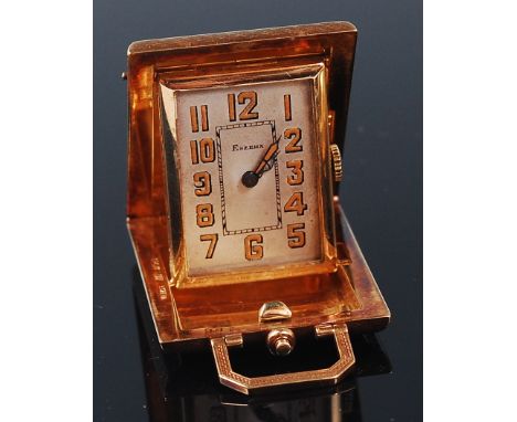 An Eszeha 14ct gold cased ladies purse watch, having fine engine turned case, signed silvered dial with luminous Arabic numer