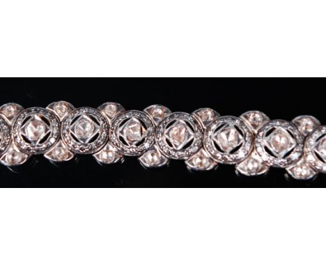 A Victorian yellow metal, platinum faced diamond set bracelet, the circular links each centre set with a rose cut diamond, wi