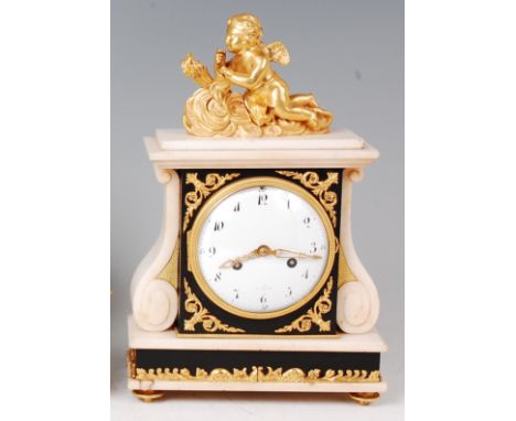 A 19th century French white marble and ormolu mounted mantel clock, the whole surmounted with a winged cherub with flaming to