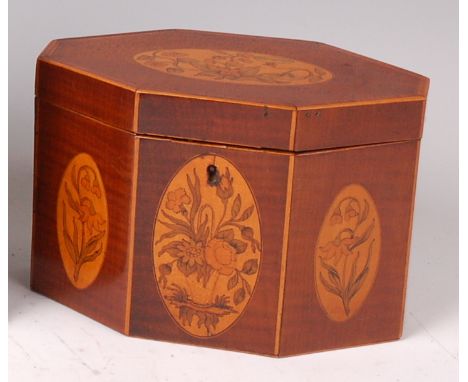 A late Georgian fiddleback mahogany and marquetry inlaid tea caddy, of shaped octagonal form, inlaid with four specimen marqu