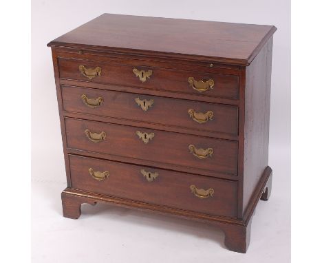 An early George III mahogany chest, having brushing slide over four long graduated drawers, brass batwing escutcheons, and on
