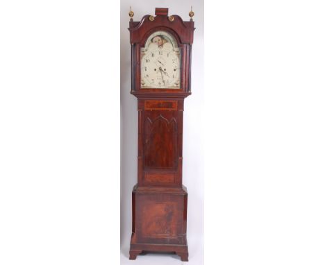 A circa 1830 mahogany and inlaid longcase clock, having swan neck pediment above a painted arch dial signed E Radford of Hanl