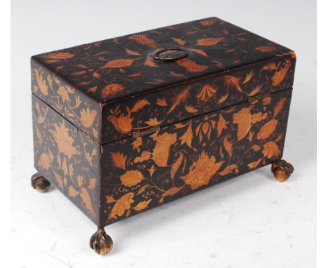 A Regency black lacquered and gilt decorated tea caddy, the hinged lid revealing twin compartment fitted interior, each with 