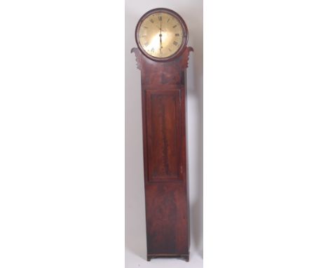 An early 19th century mahogany longcase regulator, having a circular unsigned brass face with Arabic and Roman numerals, subs
