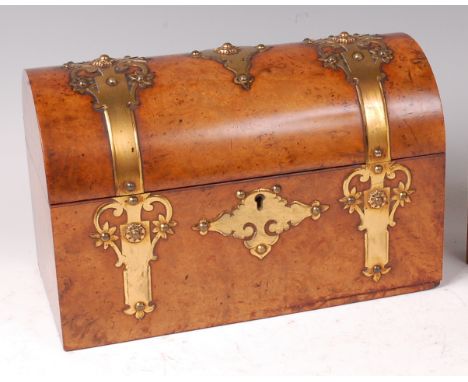 A mid-Victorian burr walnut dome top tea caddy, having pierced brass strapwork hinges and escutcheons, opening to reveal two 