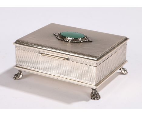 Continental silver box and cover, with green stone inset engine turned lid, black velvet lined interior, on four paw feet, st