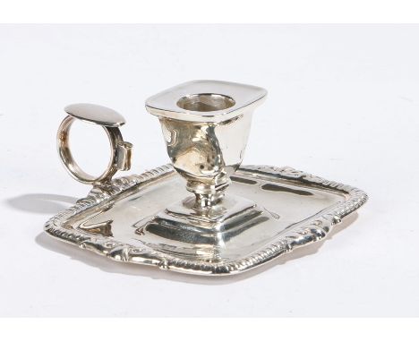 George III silver chamber stick, marks rubbed, the rectangular sconce on a rectangular drip tray base with gadrooned border a