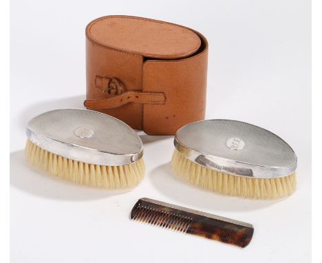 Pair of George V silver handled brushes and comb, London 1929, maker William Comyns &amp; Sons Ltd, the brushes with engine t