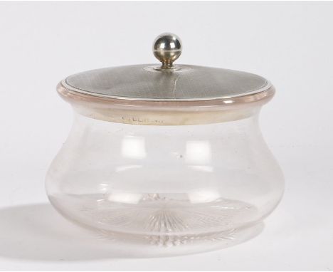 Early 20th Century silver and clear glass powder bowl, Birmingham, marks rubbed, the engine turned circular silver lid with o