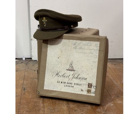 Post war, a mixed lot of uniforms and webbing etc., in R.E.M.E. Officer's peaked cap in Herbert Johnson box, greycoat, battle