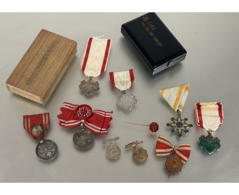 Japan: Imperial Order of the Sacred Treasure 7th Class. Order of the Rising Sun 8th Class, Red Cross medal with rosette, anot