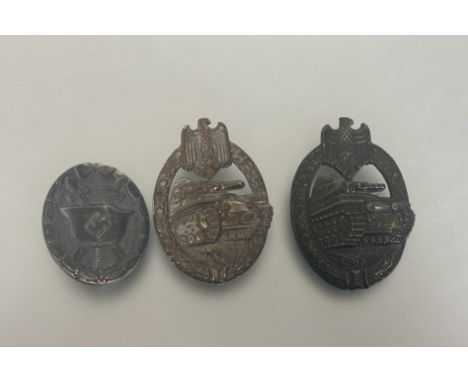 WWII Germany: Assault Badge in silver plate on bronze, pin and hook missing together with another brass pressed Assault badge