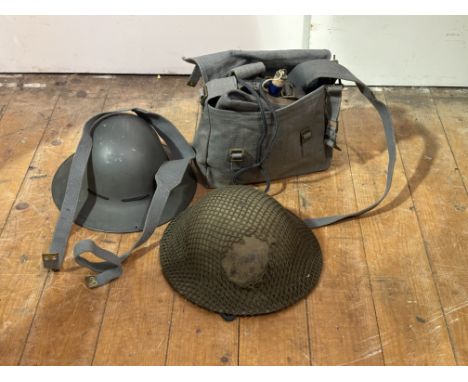 WWII steel helmet, original green painted, string net cover, liner and elasticated chin strap.&nbsp; A.R.P helmet and blue we