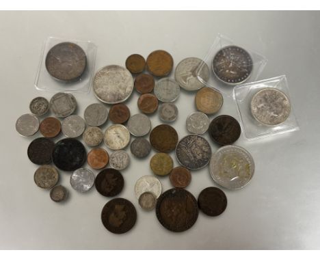 Bag of mostly foreign coins (two British) includes 14 silver, 1985, 1900 and 1922 silver dollars