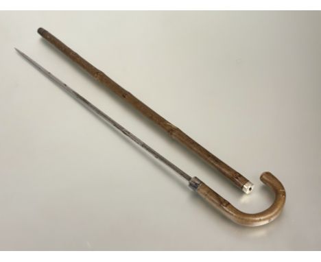 Wilkinson Sword sword stick, the wooden stick with silver collar (JS&amp;S) sterling, enclosing an etched blade 68cm (total l