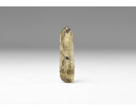 A well formed prismatic piece of quartz with black anatase (titanium dioxide) crystals to the surface with handwritten label 