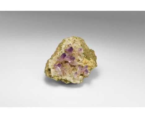 A specimen of prismatic amethyst crystals with quartz crystals on a rock groundmass, from the famous locality at Queretaro, M