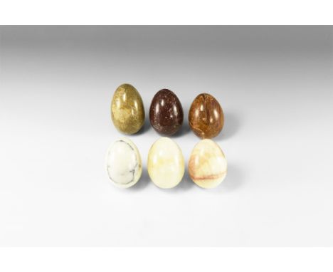 A group of six polished gemstone eggs including: marble, jasper, fossiliferous limestone, etc. See Bonewitz, Dr. Ronald Louis