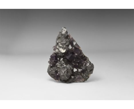A Cumbrian specimen of galena with fluorite, the galena in octahedron-modified cubes and slightly rounded by resorption, the 