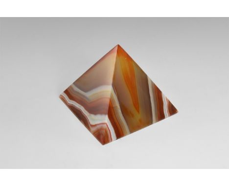 An exceptionally fine pyramid cut in banded Brazilian agate, with perfect pyramid form and highly polished faces and base. Se