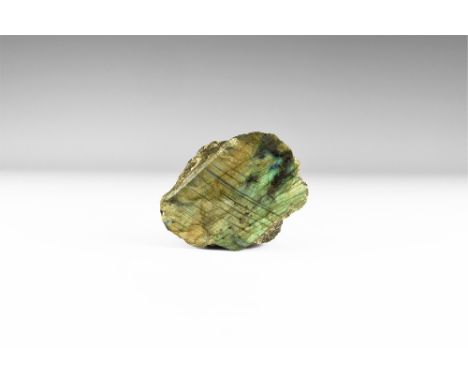 An exceedingly fine display specimen of labradorite, polished on one side, with blue, yellow, and green 'schiller' on the ent