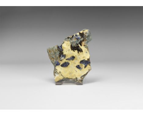 An unusual matrix specimen of brilliant blue benitoite crystals, with three major crystals and a number of minor ones, from t