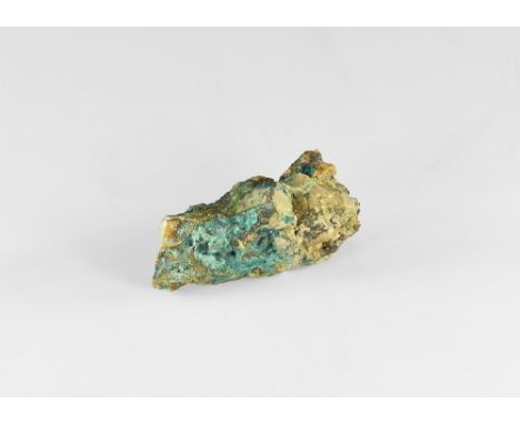 A piece of spangolite crystal with dense structure of tiny green crystals; with hand written old adhesive tape label to the s