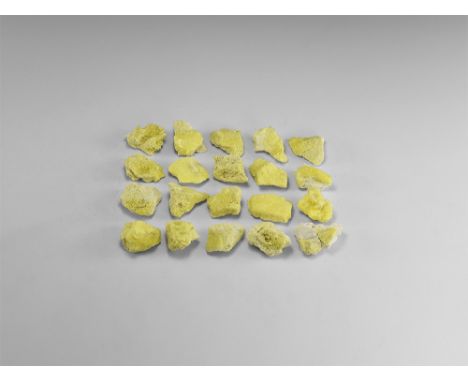 A group of twenty yellow chunks of sulphur displaying clusters of small crystals. See Bonewitz, Dr. Ronald Louis, Rocks & Min