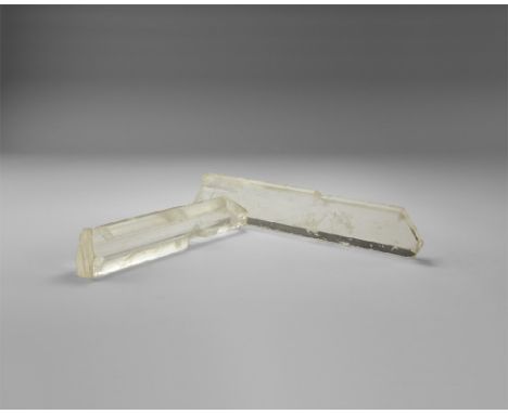 A group of two selenite gypsum crystals, transparent, well-formed, and nicely terminated, in old white card tray. See Bonewit