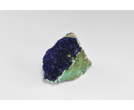 A fine specimen of azurite on matrix, with malachite rosettes front and back of the specimen, from Arizona, USA. See Bonewitz