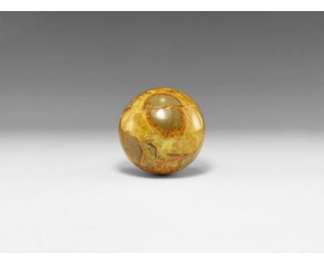 A large polished sphere of septarian concretion, with yellow and brown calcite, including yellow calcite crystals. See Bonewi