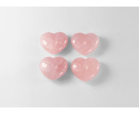 A group of four cut and polished rose quartz in the shape of a love heart; each in a display box. See Bonewitz, Dr. Ronald Lo