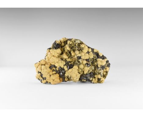 A large display specimen of lustrous haematite crystals on a base of pyrite and quartz, with overgrowths of calcite, quartz, 