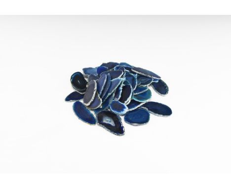 A group of fifty cut and polished agate slices with bands of colour ranging from deep blue to creram; colour enhanced. See Bo