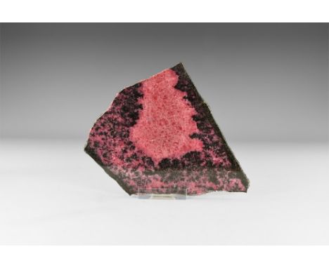 A fine, polished slice of rhodonite with a classic mix of red and black. See Bonewitz, Dr. Ronald Louis, Rocks & Minerals, 20