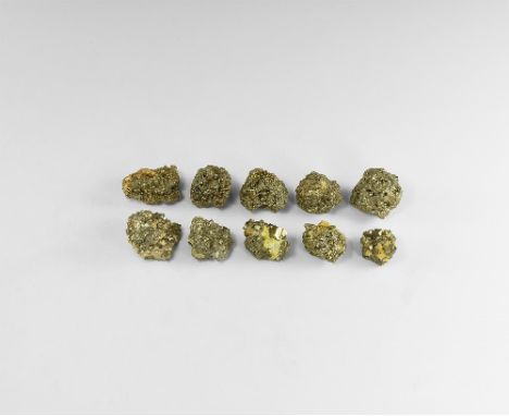 A group of pyrite specimens with well-formed crystals ranging in size; some on a matrix. See Bonewitz, Dr. Ronald Louis, Rock