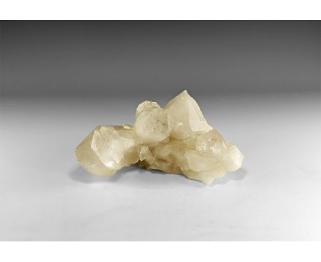 A large formation of quartz crystals showing perfect crystal form, transparent to translucent, with natural, unaltered faces,