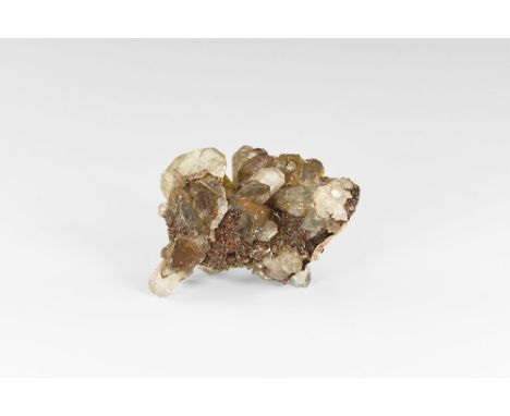 A specimen of tabular, fully terminated cerussite crystals from the classic Tsumeb, Namibia, locality with adhesive tape labe