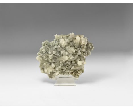 A group of unusually formed, frosted calcite crystals on matrix. See Bonewitz, Dr. Ronald Louis, Rocks & Minerals, 2008, p.17
