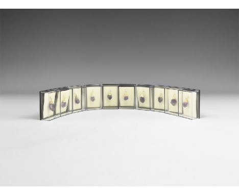 A group of ten amethyst points set with gilded mounts and suspension rings; each in a perspex display box. See Bonewitz, Dr. 