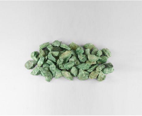 A group of twenty fuschite mica chunks with a waxy green lustre. See Bonewitz, Dr. Ronald Louis, Rocks & Minerals, 2008, p.26