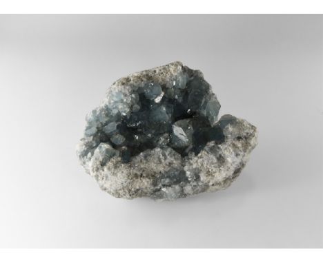 A celestine (also called celestite) geode filled with large, finely-formed, sky-blue celestine crystals, the largest crystals