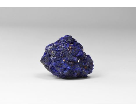 A very fine, intensely coloured, nearly spherical group of lustrous azurite crystals, from China, in old white card tray. See