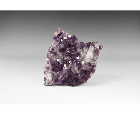 A very unusual specimen of quartz crystals with amethyst tips, on matrix. See Bonewitz, Dr. Ronald Louis, Rocks & Minerals, 2